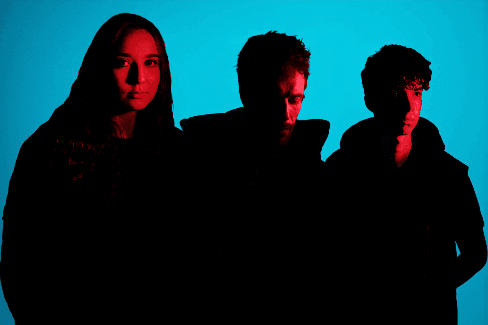 Band promotional portrait with cyan and red lighting